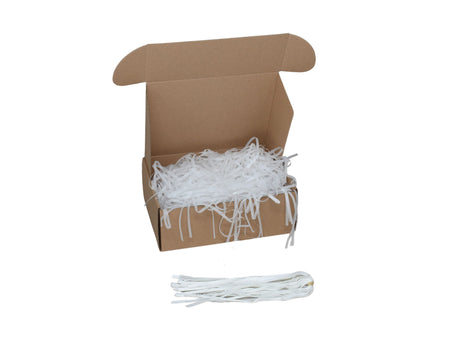Umplutură din hârtie de mătase albă expusă într-o cutie cadou natur