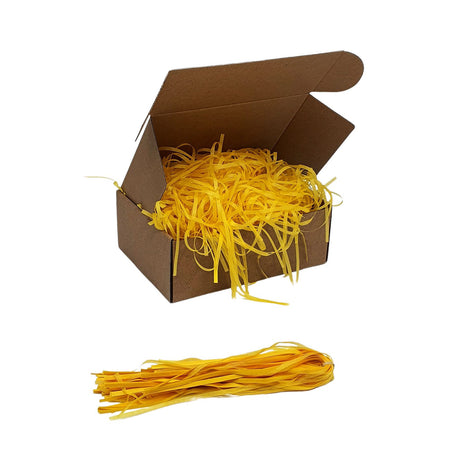 Umplutură din hârtie de mătase galbena expusă într-o cutie cadou natur