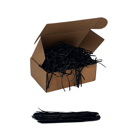 Umplutură din hârtie de mătase neagră expusă într-o cutie cadou natur