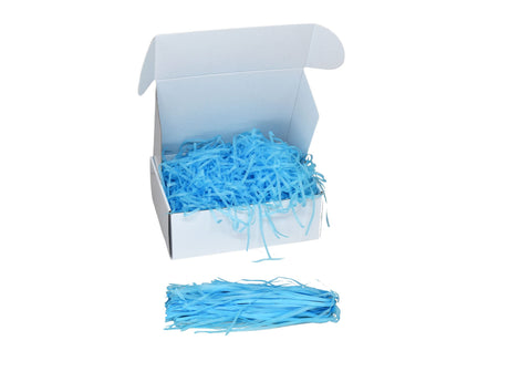 Umplutură din hârtie de mătase turqoise expusă într-o cutie cadou albă