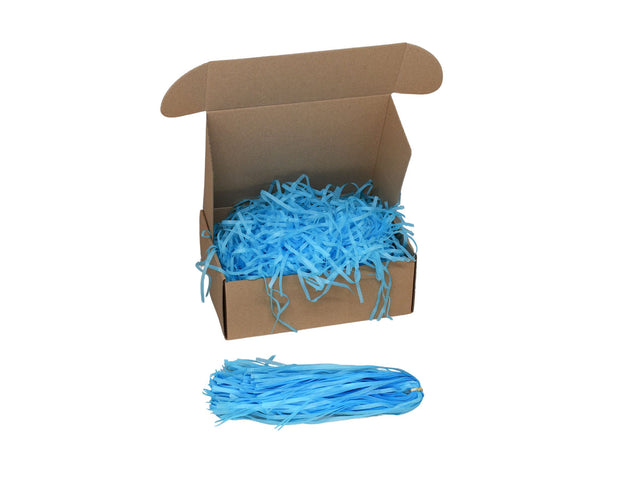 Umplutură din hârtie de mătase turqoise expusă într-o cutie cadou natur