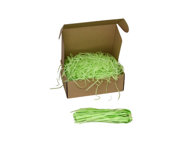 Umplutură din hârtie de mătase verde lime expusă într-o cutie cadou natur